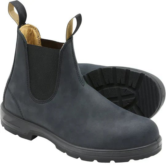 Pair of black leather Chelsea boots showing tread sole and lining