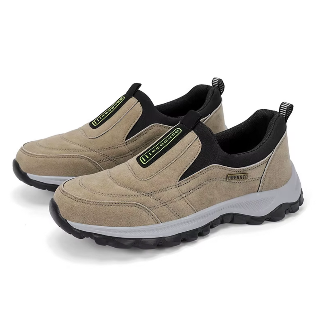 Pair of tan suede slip-on walking shoes with black accents