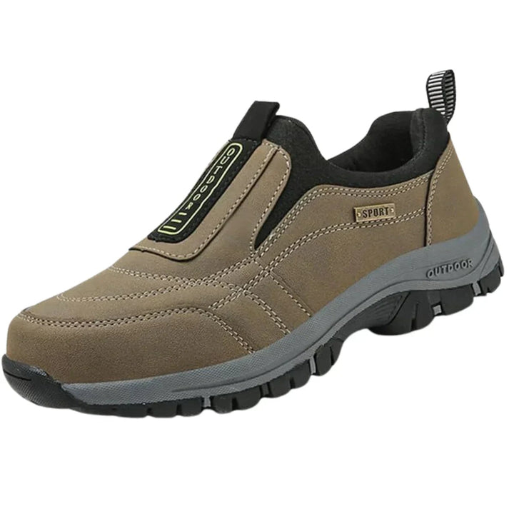 Tan suede slip-on hiking shoe with black trim and lugged sole