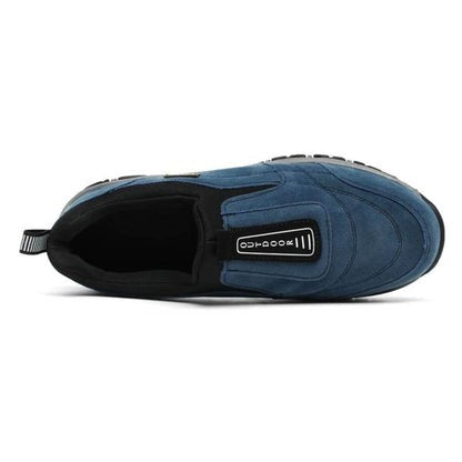 Top-down view of navy blue slip-on sneaker with black collar