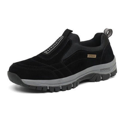 Black suede slip-on hiking shoe with thick gray tread sole