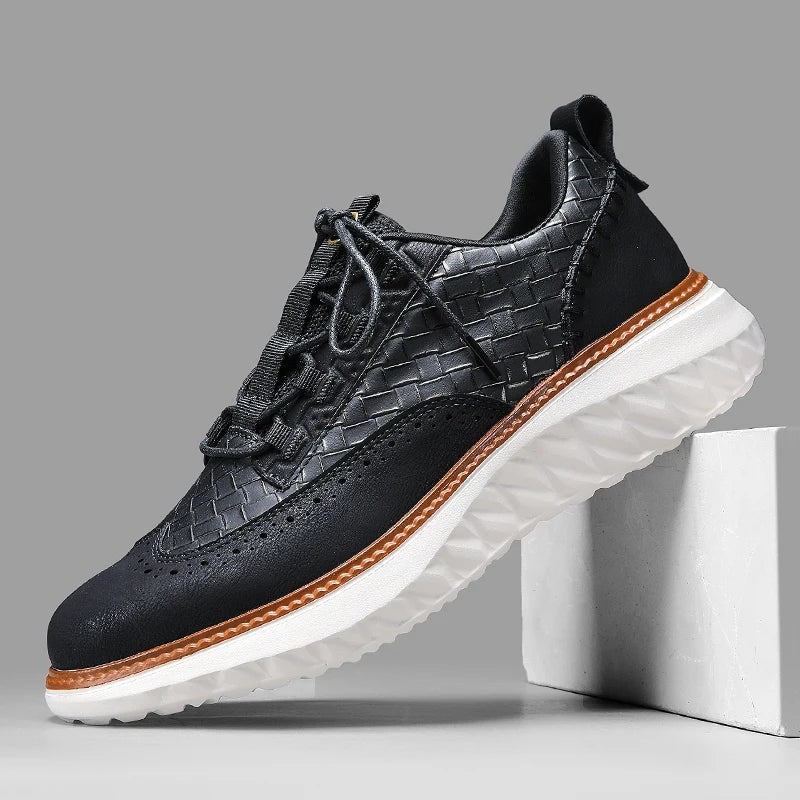Black leather woven sneaker with wingtip brogue design and white sole