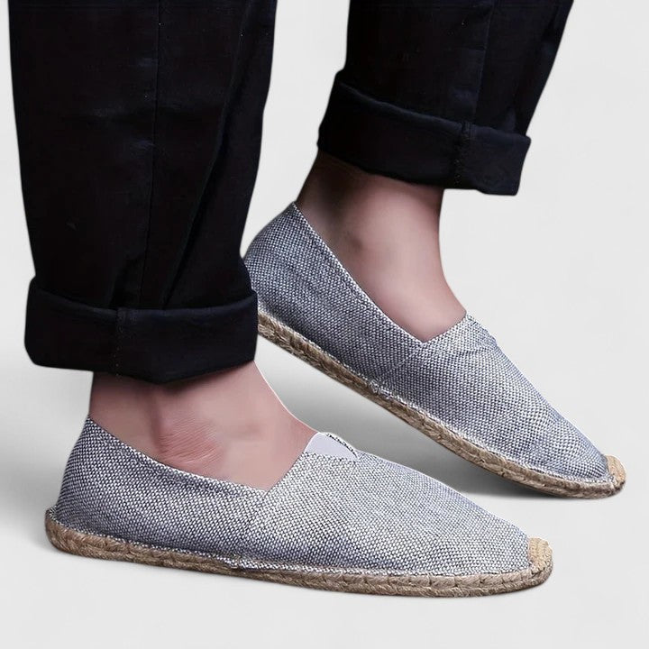 gray woven espadrilles styled with rolled black pants