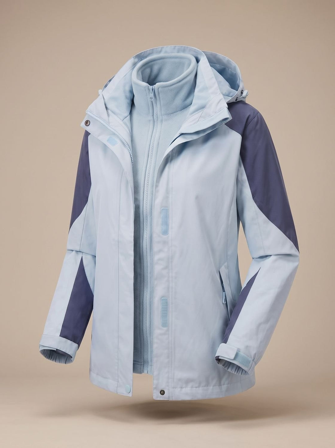 Light blue and navy colour-block hooded softshell jacket shown open, fleece visible