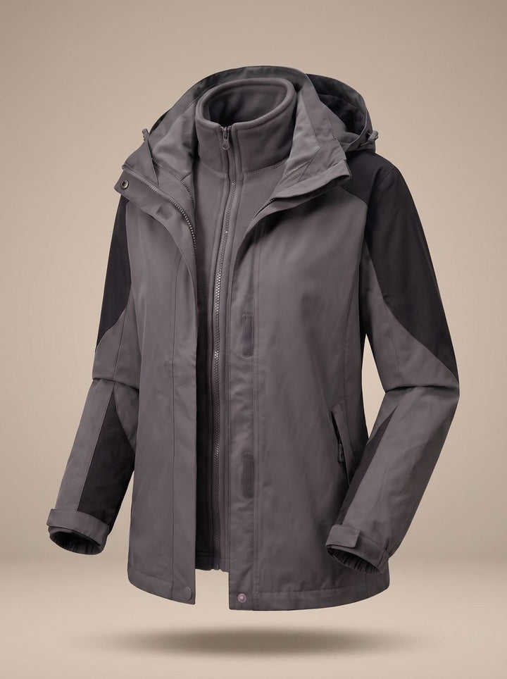 Grey and black colour-block softshell jacket shown open, revealing grey fleece liner
