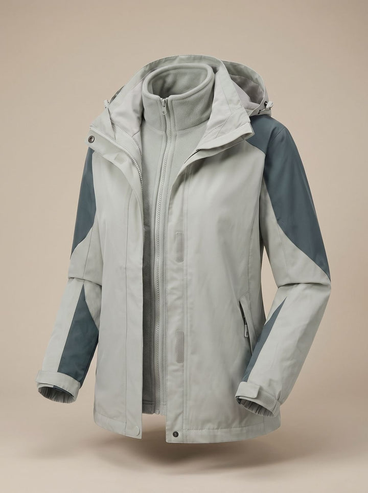 Pale grey and slate colour-block softshell jacket shown open over matching fleece