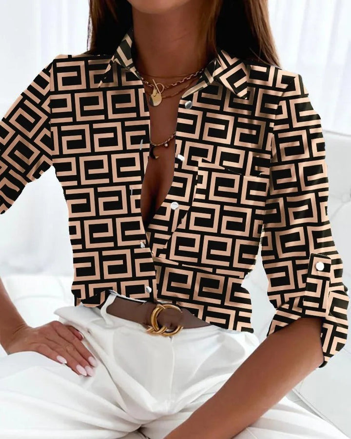Black and beige geometric print blouse with button-front collar detail