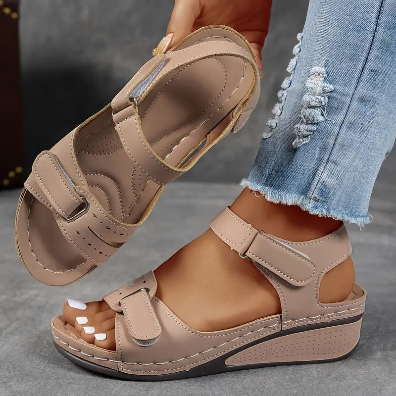 Beige orthopedic sandals with adjustable ankle strap and wedge sole