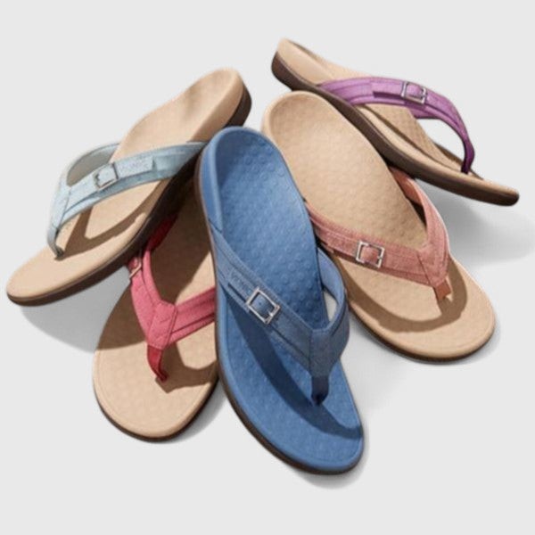 Four pairs of orthopedic flip-flop sandals in blue, pink, and purple shades