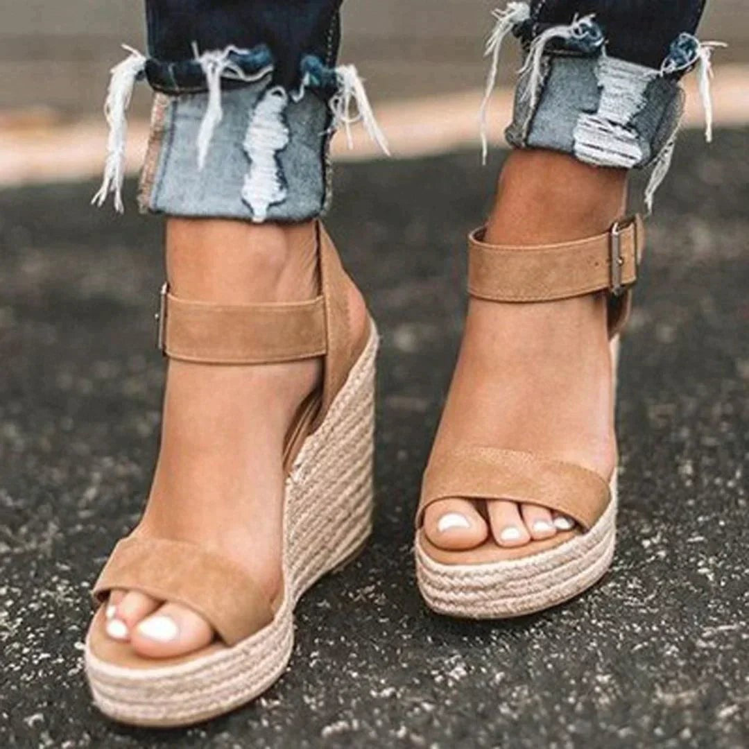 Tan suede espadrille wedge sandals with ankle strap buckle detail