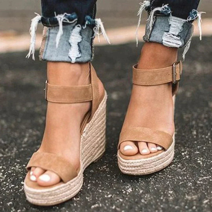 Tan suede espadrille wedge sandals with ankle strap buckle detail