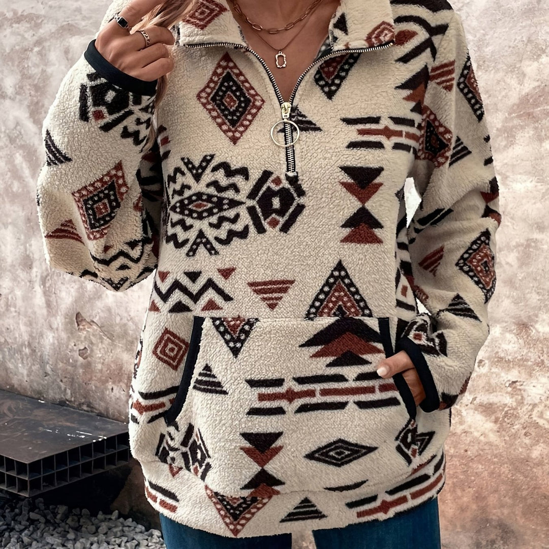 Aztec-print fleece pullover with quarter-zip collar and kangaroo pocket, worn close-up