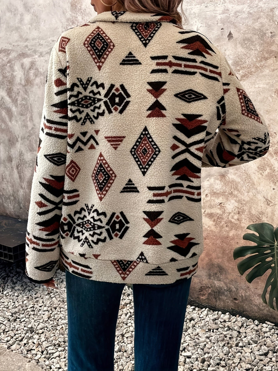 Rear view of Aztec-print fleece pullover showing geometric pattern across the back