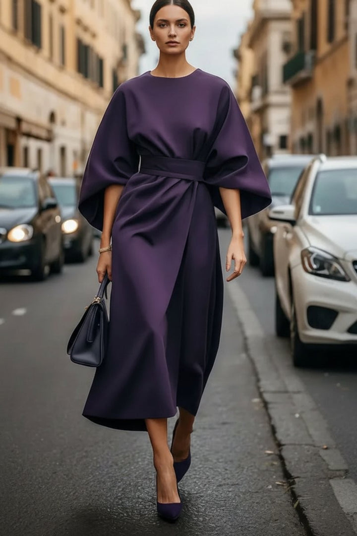 Deep purple cocktail midi dress featuring dramatic bell sleeves