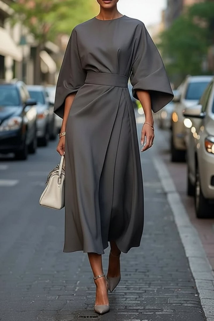 Charcoal gray midi dress featuring bell sleeves and cinched waist