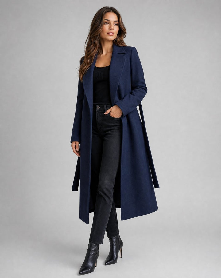 Navy wool-blend trench coat paired with black jeans and ankle boots