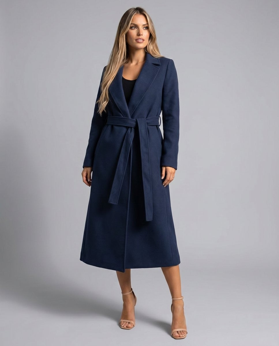 Navy belted trench coat with notch lapel styled with nude heels