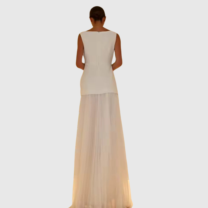 Back view of ivory sleeveless gown showing pleated skirt and zipper detail