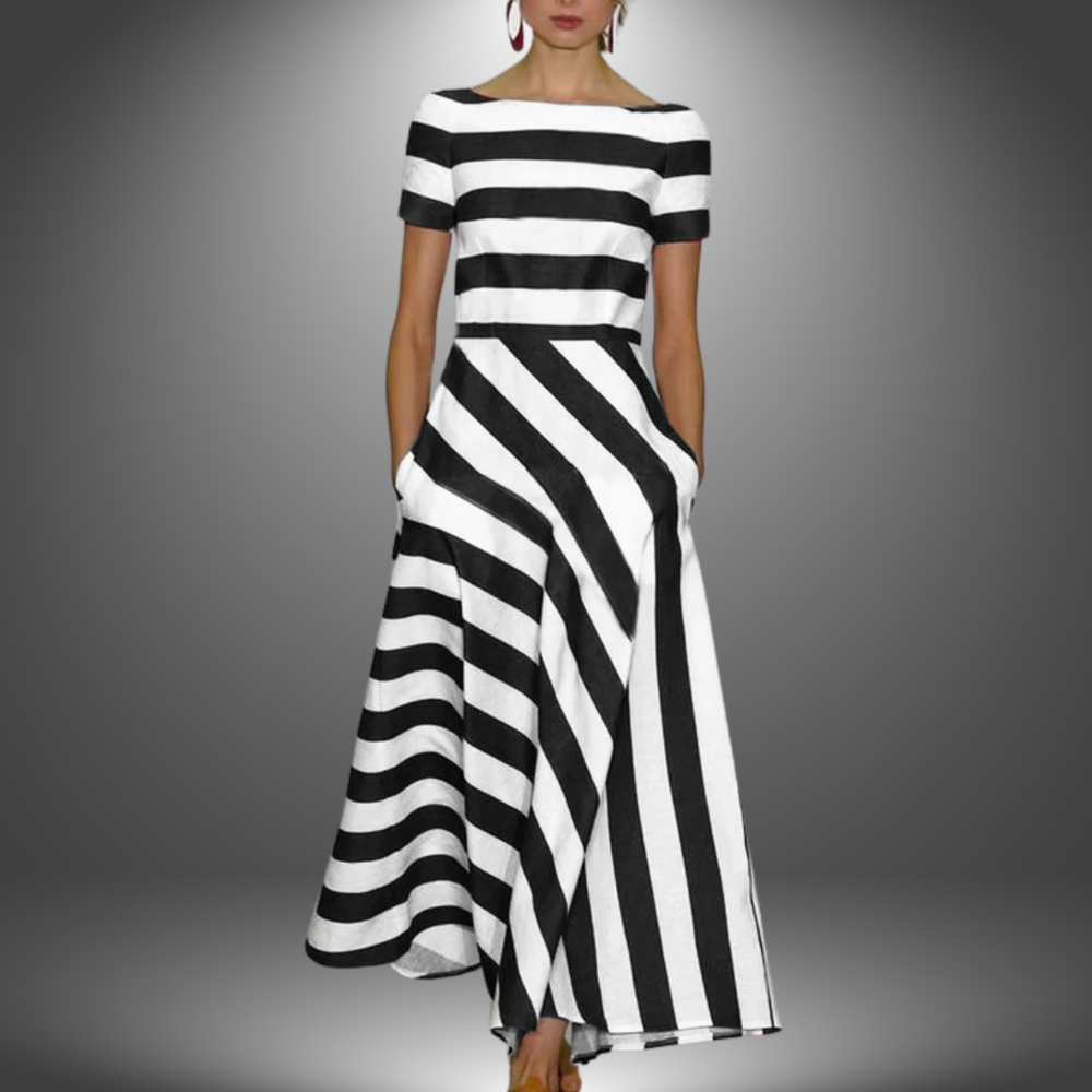 Black and white striped maxi dress featuring boat neckline and full A-line skirt