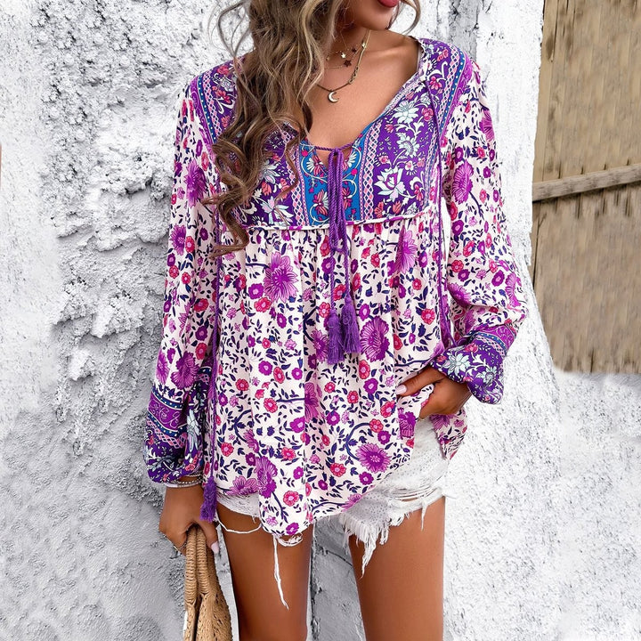 Purple floral boho blouse with tasseled V-neck and balloon sleeves