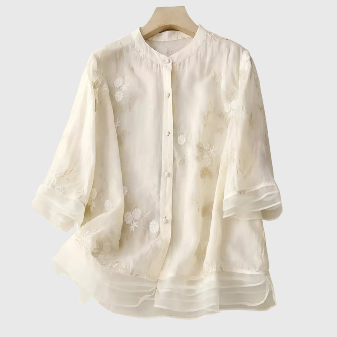 ivory sheer blouse with floral embroidery and mandarin collar on hanger