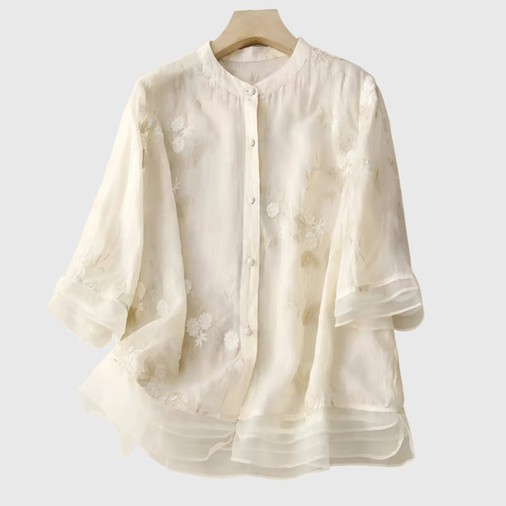 ivory sheer blouse with floral embroidery and mandarin collar on hanger