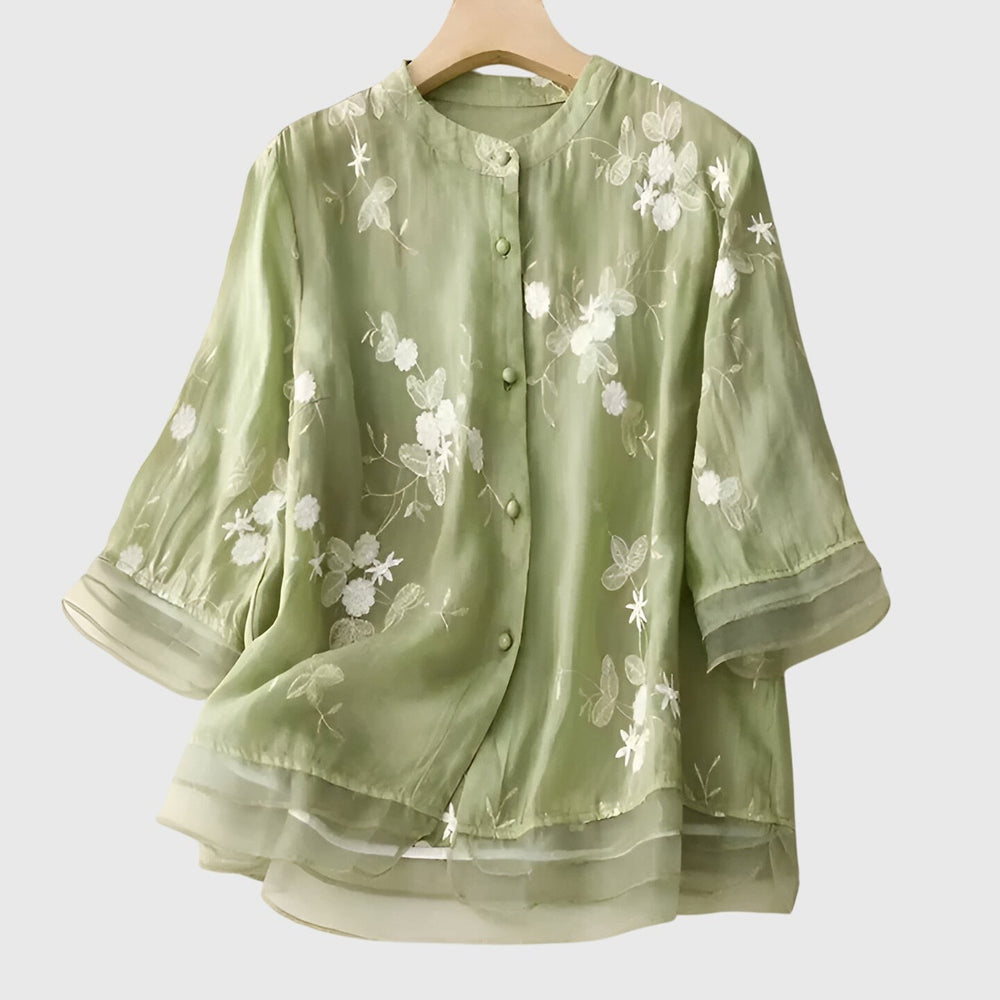 sage green organza blouse with white floral embroidery and button front