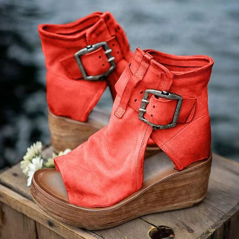 Red leather open-toe wedge booties featuring silver buckle detail