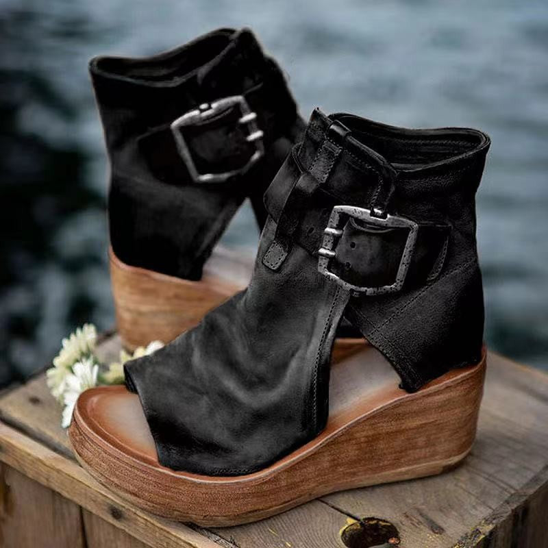 Black leather cutout wedge sandals with double buckle ankle straps
