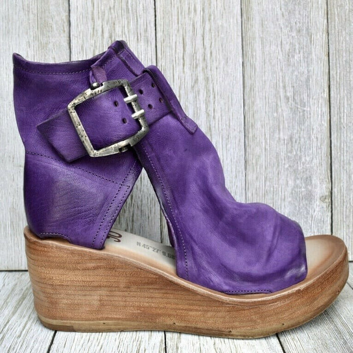 Purple leather wedge sandal with oversized silver buckle, side view