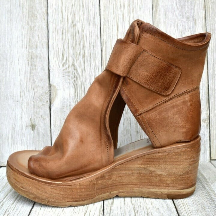 Tan leather wedge sandal with hook-and-loop closure, side view