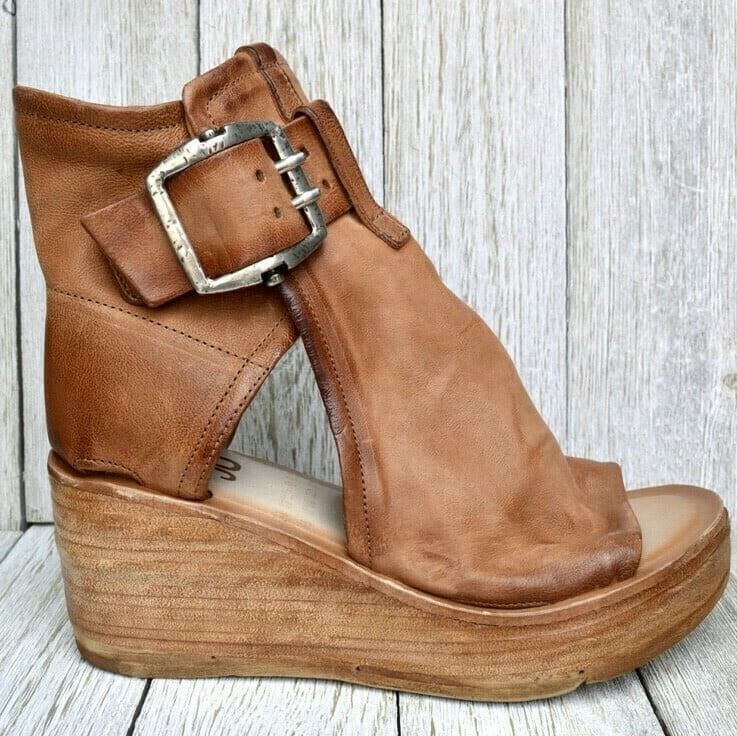Cognac leather wedge sandal with silver buckle and open toe design