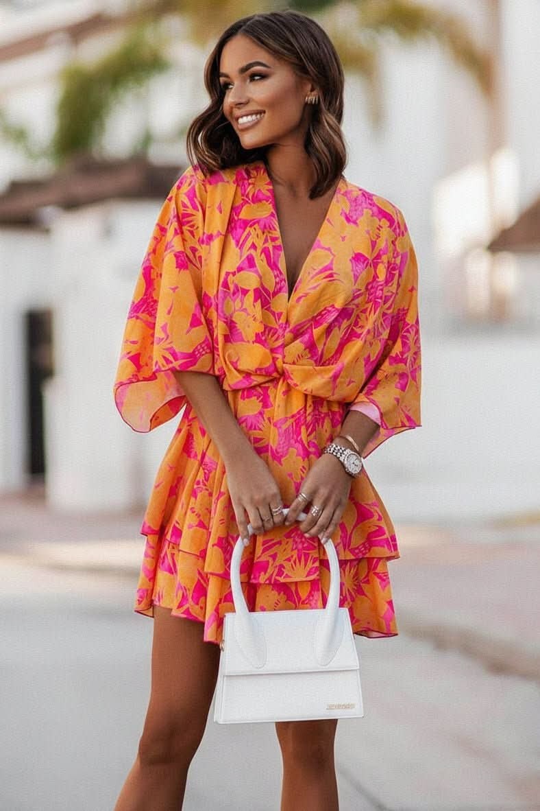 orange and pink tropical-print mini dress with tiered ruffle skirt