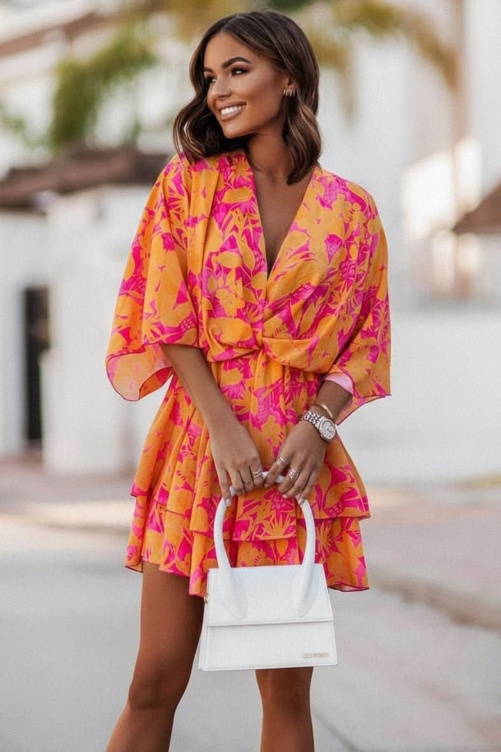 orange and pink tropical-print mini dress with tiered ruffle skirt
