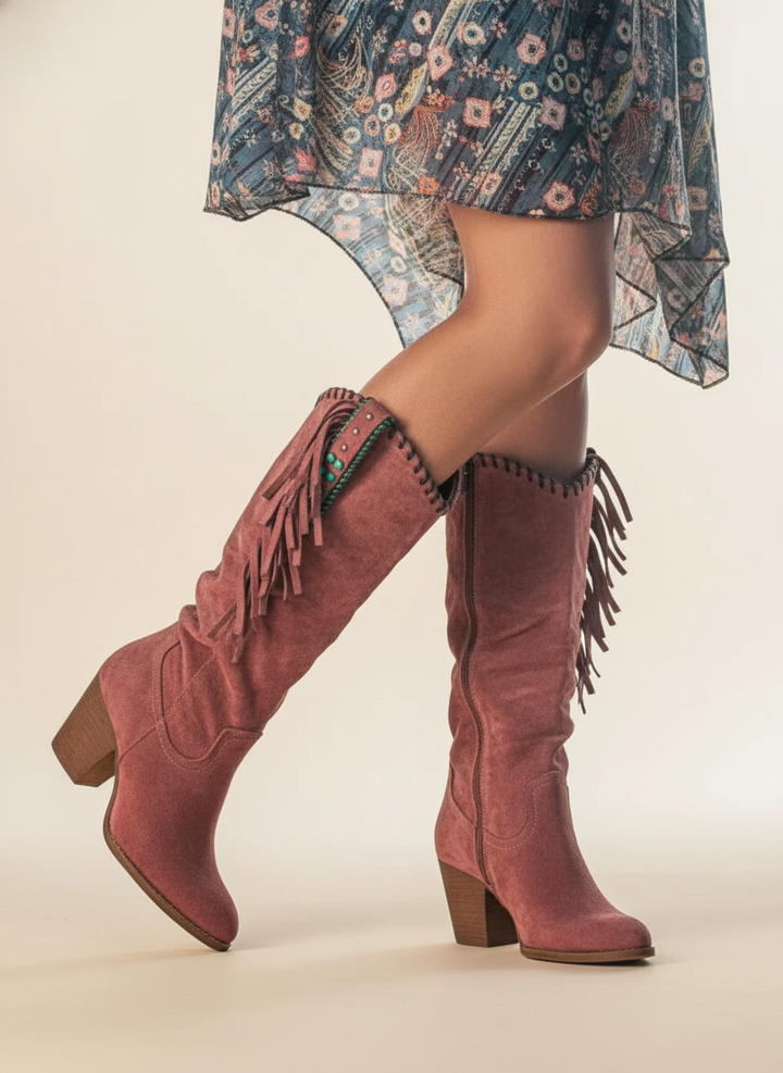 Dusty rose suede knee-high boots with fringe and turquoise concho detail