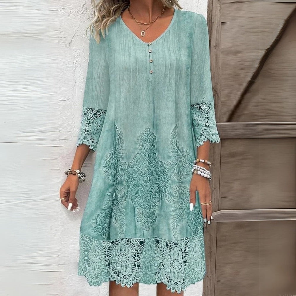 Mint green floral midi dress featuring crochet lace sleeve and hem detail