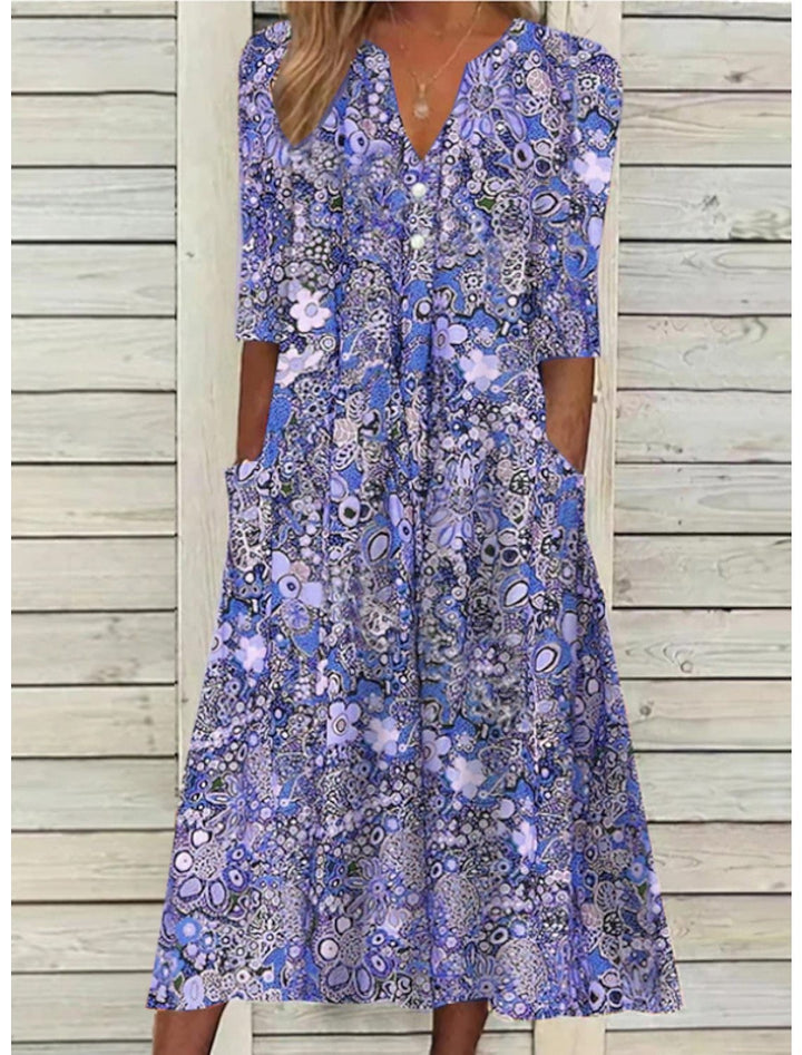 blue paisley print midi dress featuring button placket and pockets