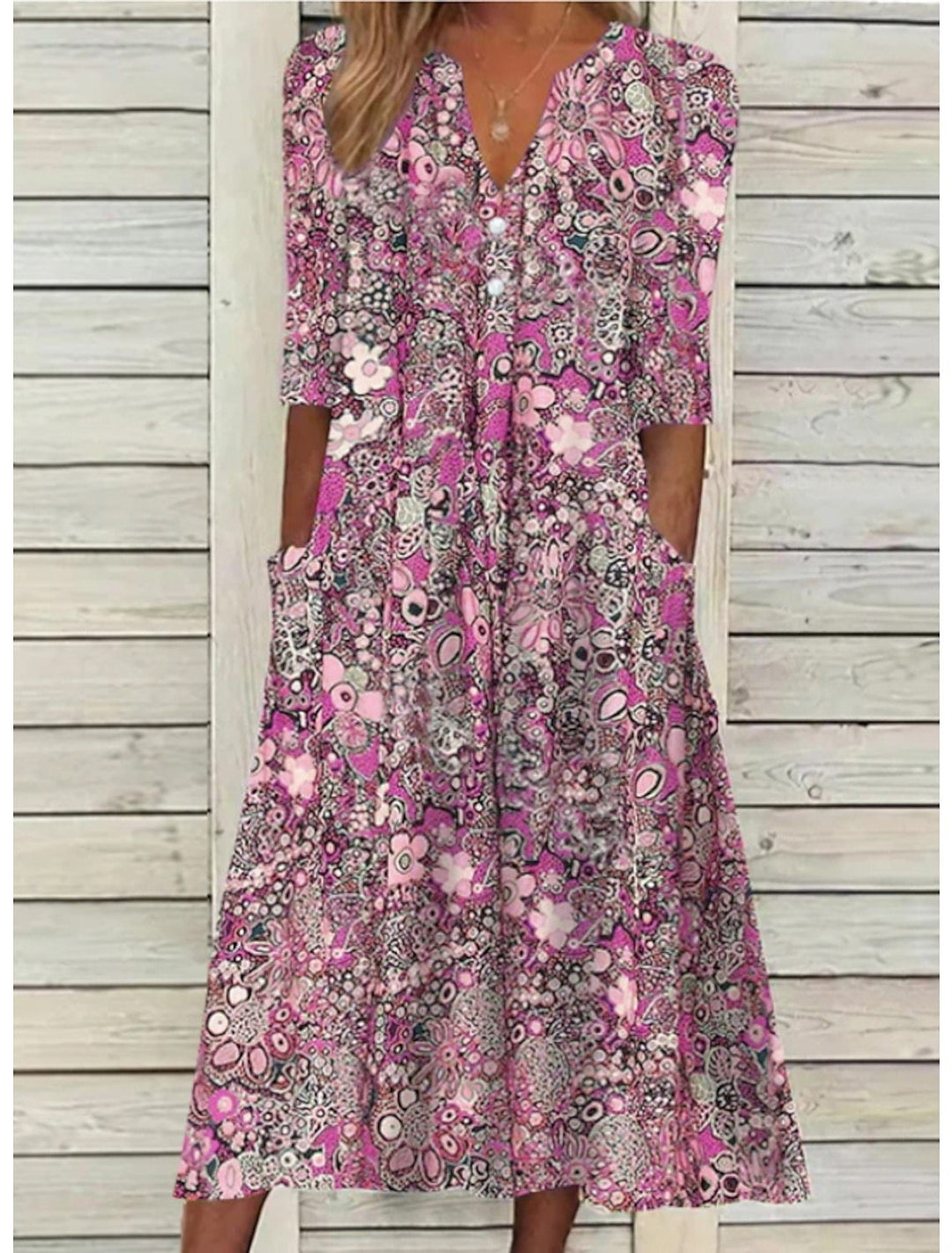 pink floral print flowy midi dress with V-neckline and side pockets