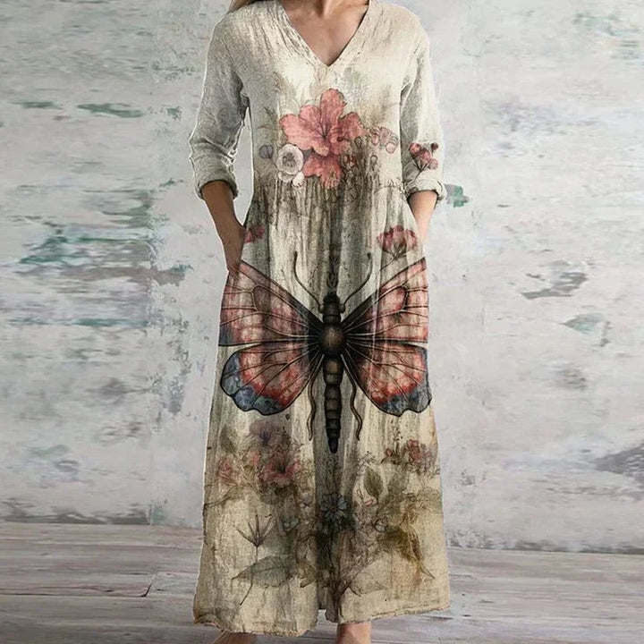 beige butterfly and floral print maxi dress with three-quarter sleeves