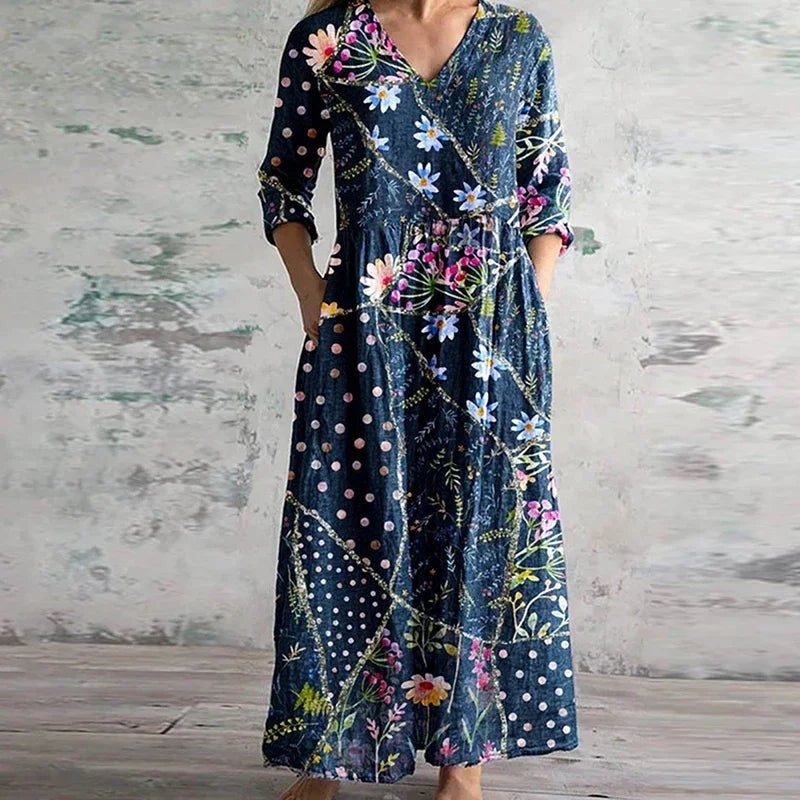 Navy floral maxi dress with polka dot accents and three-quarter sleeves