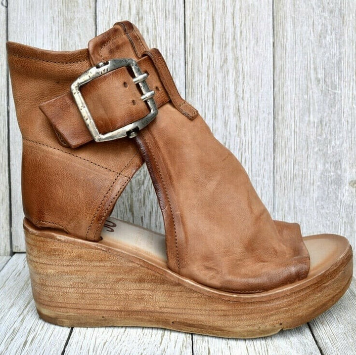 cognac leather cutout wedge bootie with silver buckle closure