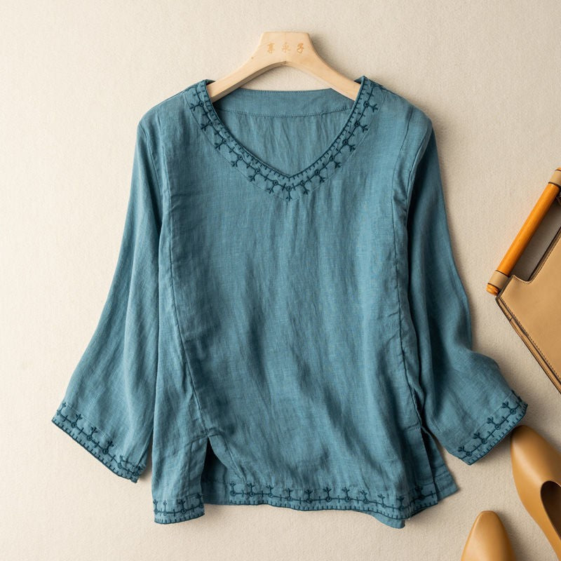 Teal linen blouse with embroidered neckline and three-quarter sleeves