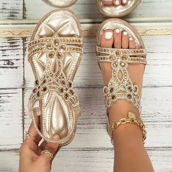 Gold rhinestone sandals with amber crystal floral straps and metallic finish