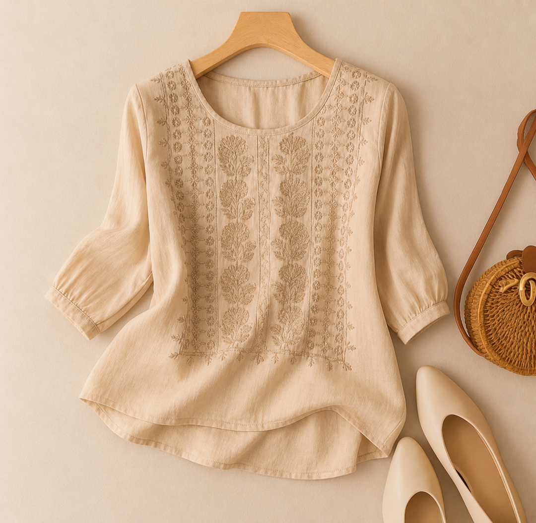 Beige floral embroidered blouse with three-quarter sleeves and relaxed fit