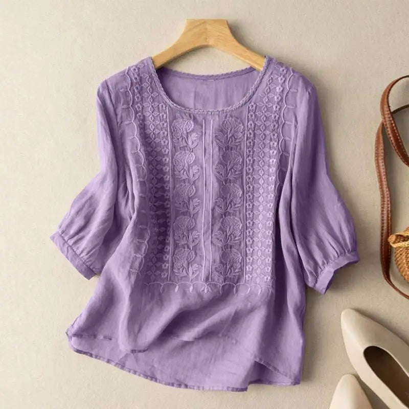 Purple floral embroidered blouse with three-quarter sleeves and scalloped trim