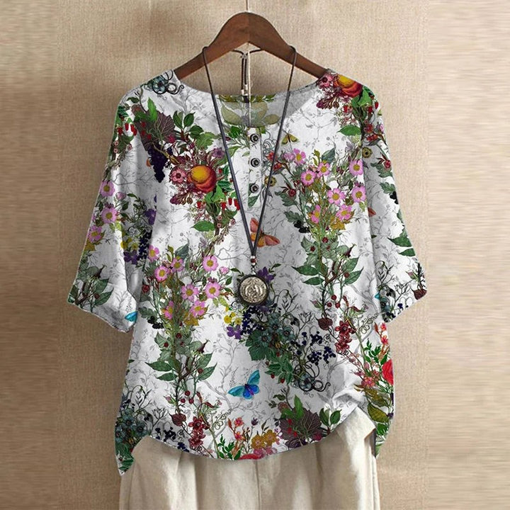 White botanical print blouse with butterfly motifs and half sleeves