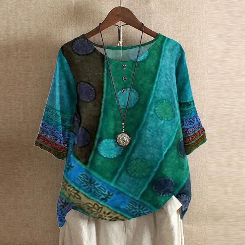 Teal and green patchwork print blouse with round medallion design, half sleeves