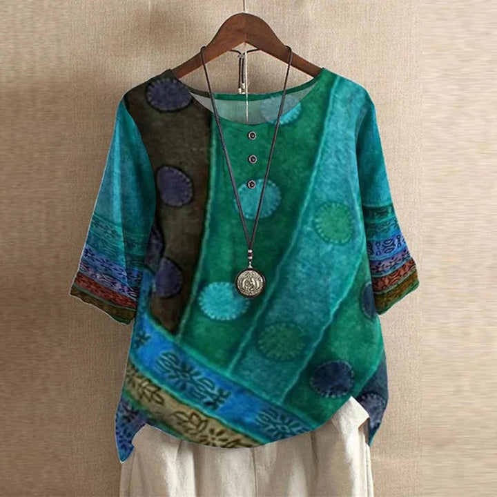 Teal and green patchwork print blouse with round medallion design, half sleeves