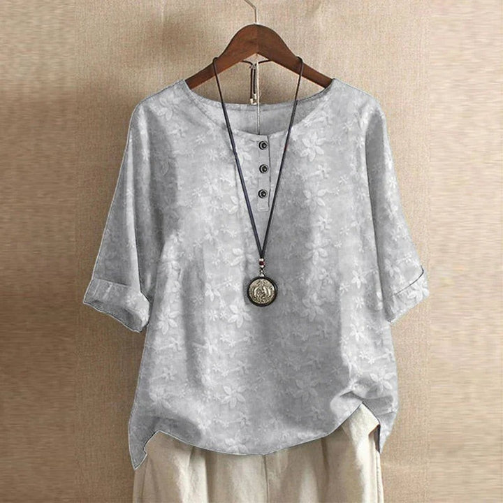 Light gray floral jacquard blouse with half sleeves and button front detail