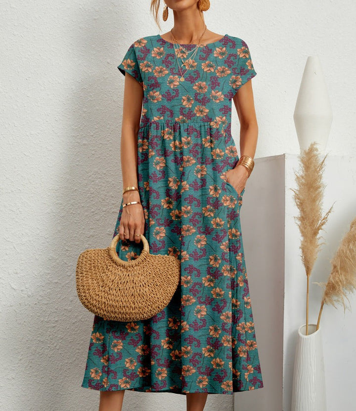 Teal floral print midi dress with cap sleeves and flowy A-line skirt